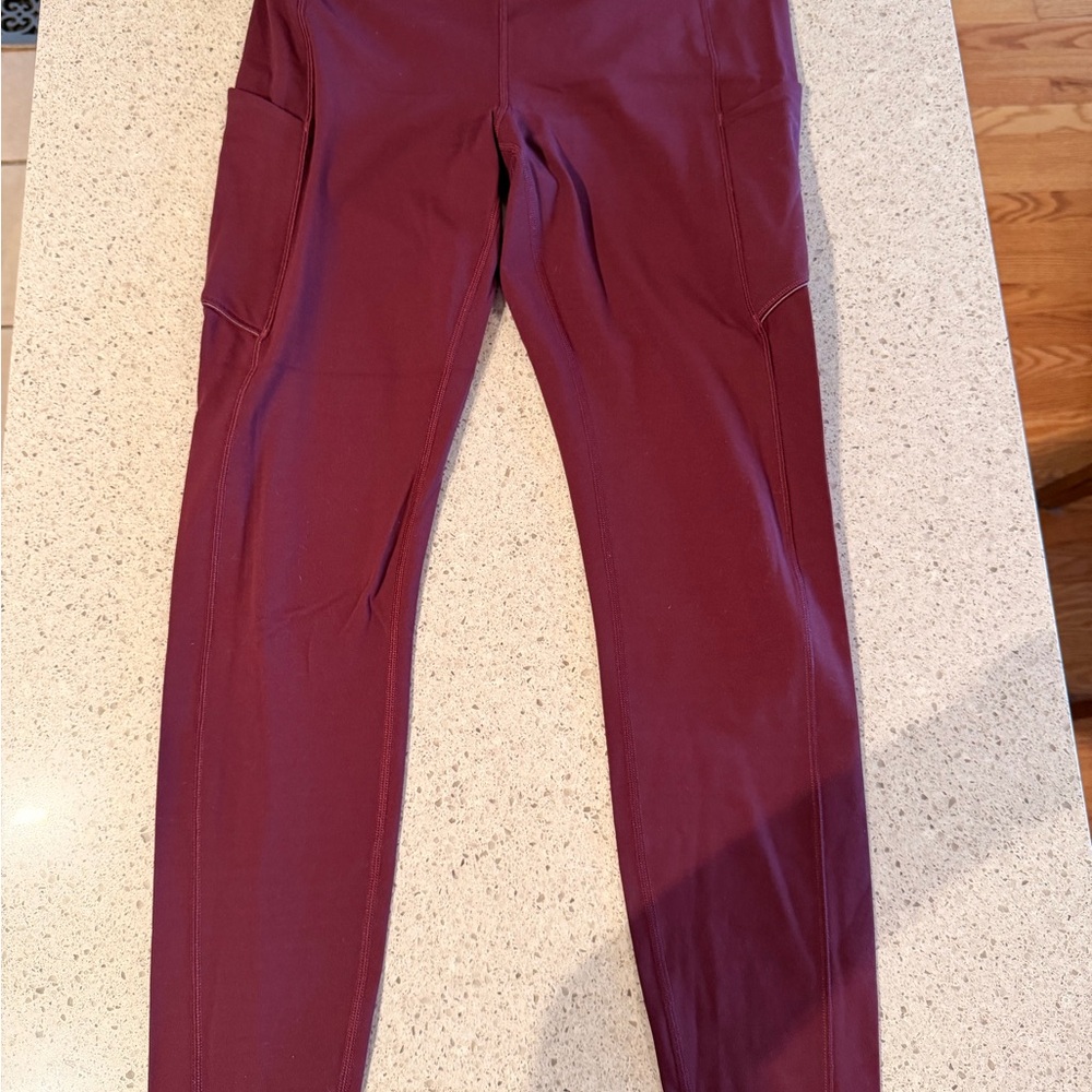 Lululemon burgundy leggings w/ pockets.
